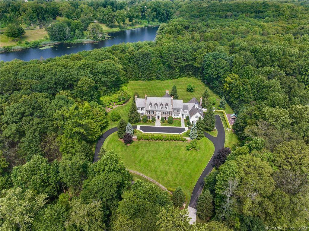 Welcome to a truly exceptional New Canaan architectural masterpiece built in 2004, nestled on a majestic private lane occupied by only 6 estates, enveloped by serene forests and 48 acres ...