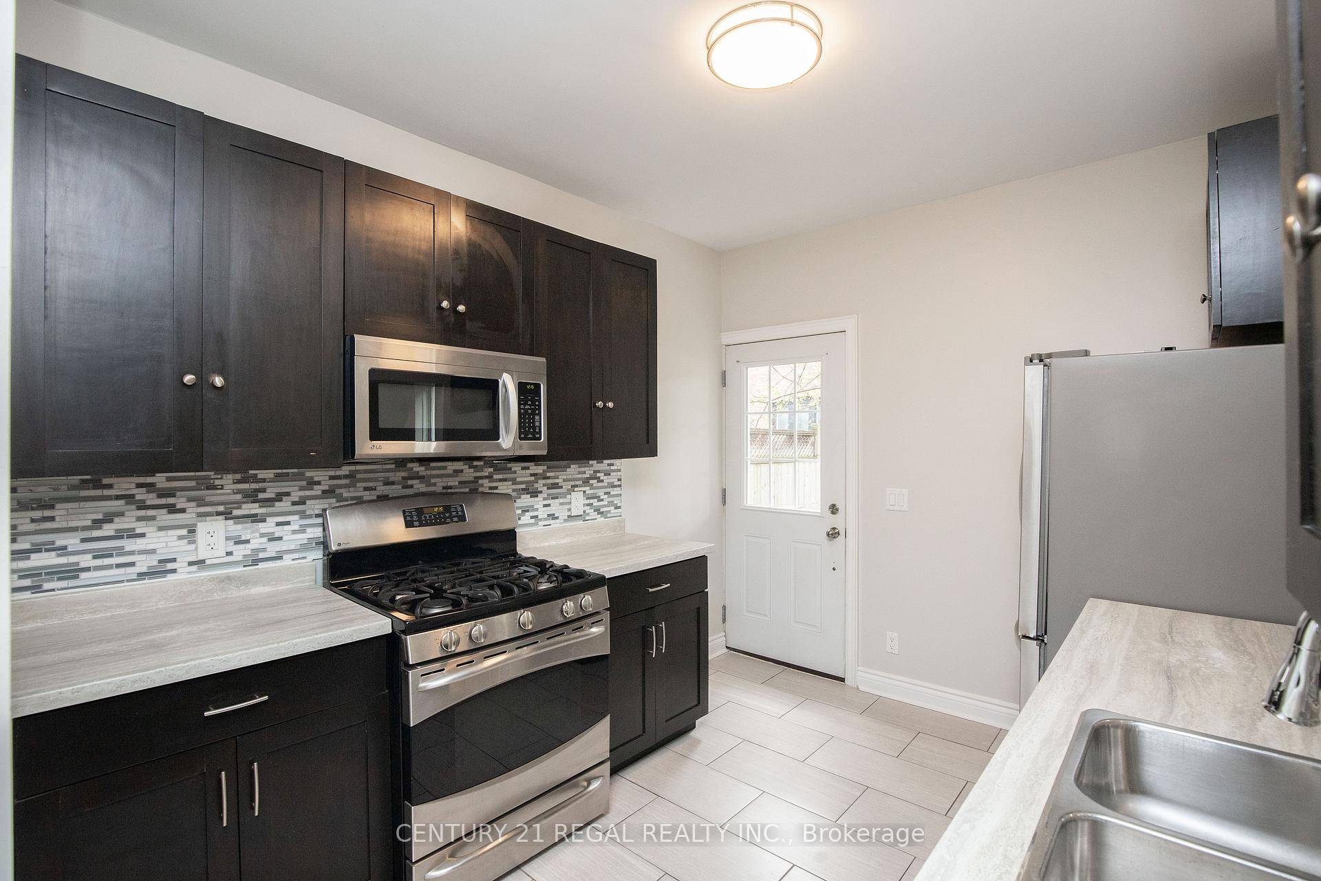 Welcome to this beautifully updated century home, offering a perfect blend of historic charm and modern convenience.