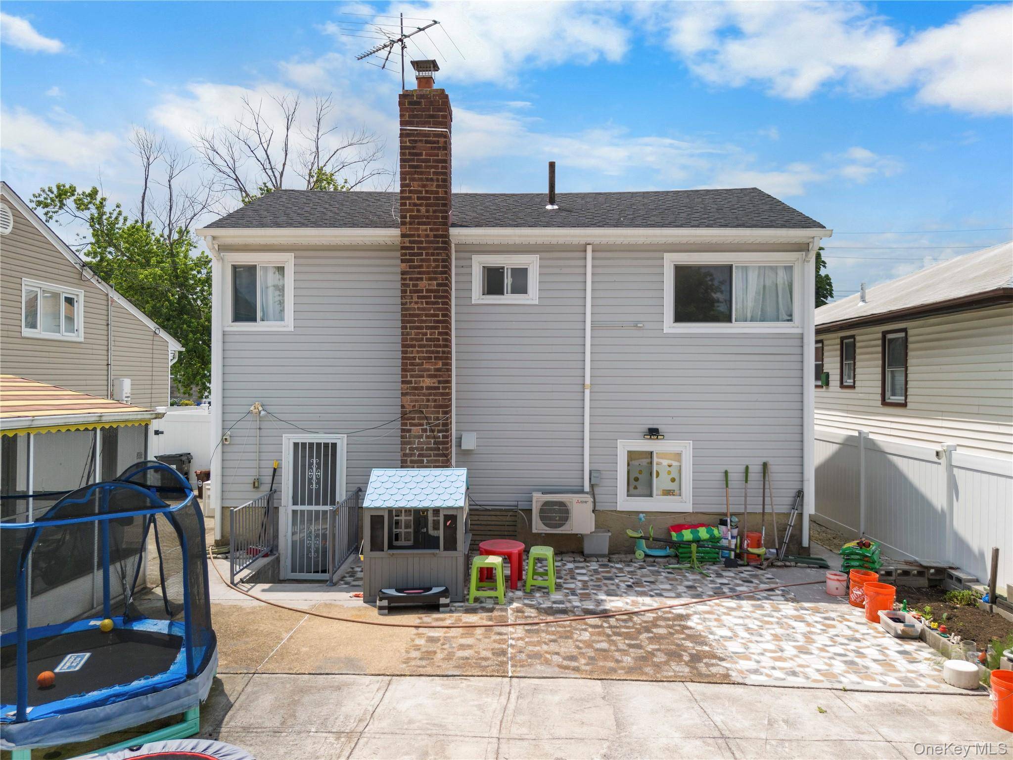 Welcome to this beautifully maintained and bright split level single family home in College Point.