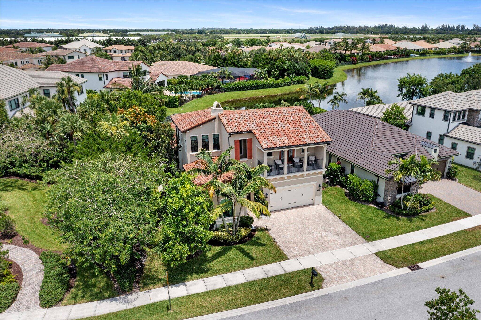 Luxurious Lakeside Living Meets Equestrian Elegance Surrounded by Verdant Stables, Racetrack Minutes to Wellington Equestrian Center Over 250K in Designer Upgrades Premium Corner Lot Panoramic Lake Views Complete Hurricane Impact ...