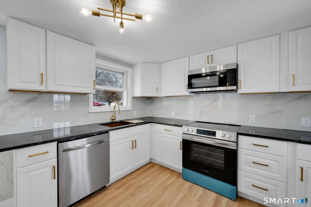 Welcome to this beautifully renovated Cape Cod style home in highly desirable North Haven, Connecticut.