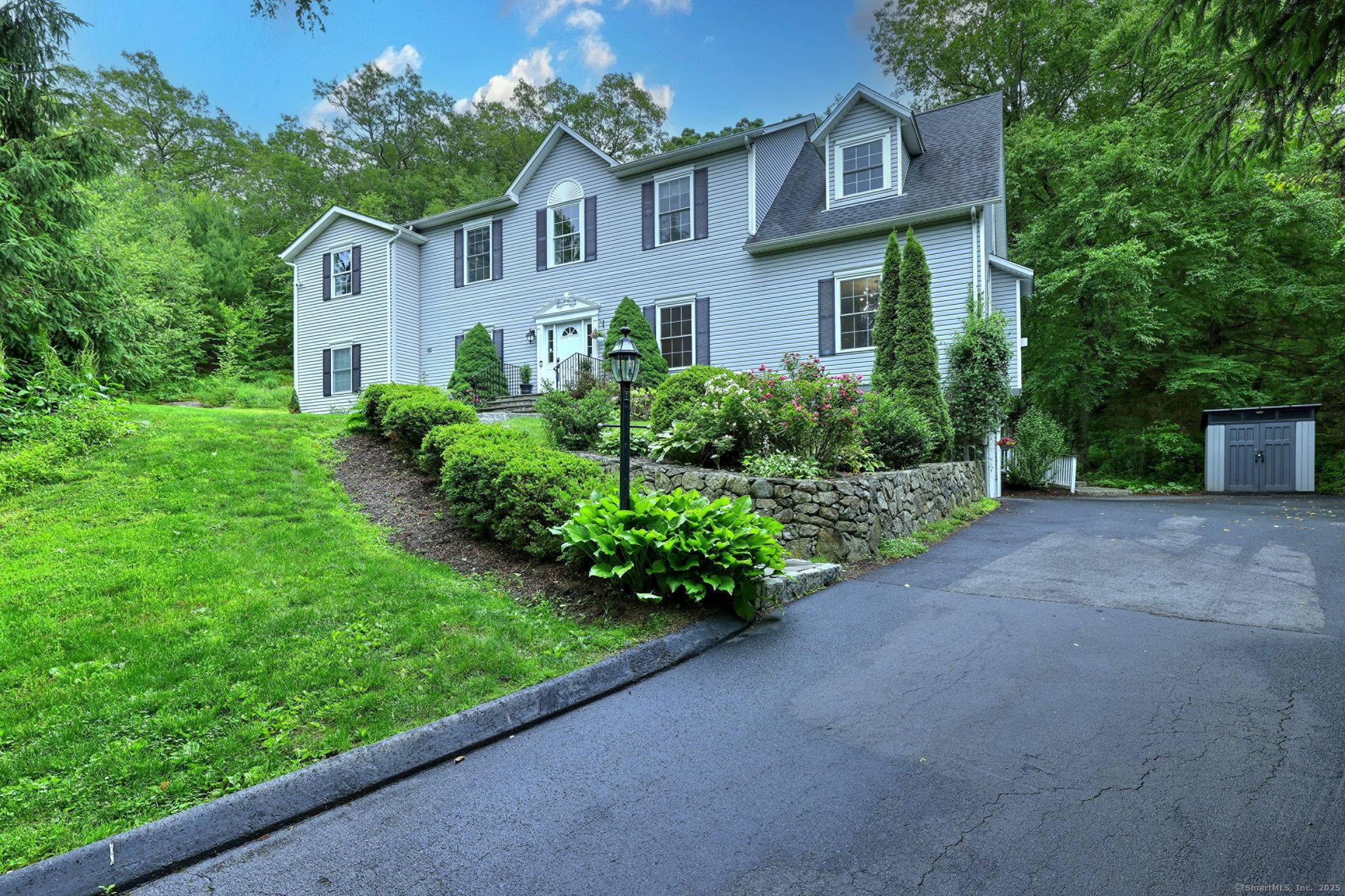 REDUCED ! MUST SEE ! This exquisite 4, 950 SF, 5BR, 4 1 2 Bath Colonial sits on a 2 acre cul de sac street.