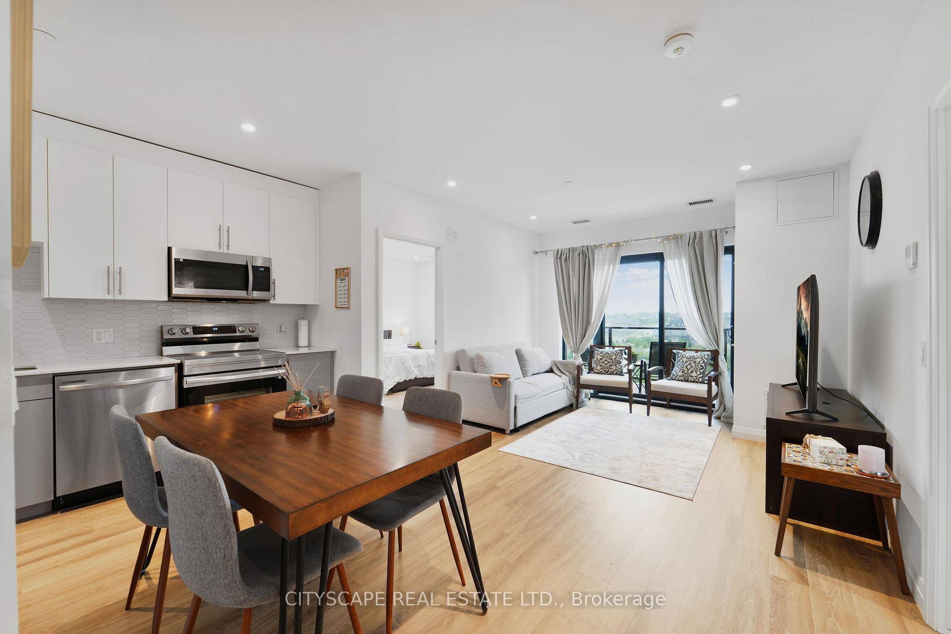Discover this spacious 2 bedroom, 2 bathroom corner unit boasting 1004 including balcony sq ft of beautifully designed living space with hardwood flooring throughout and soothing neutral colors.