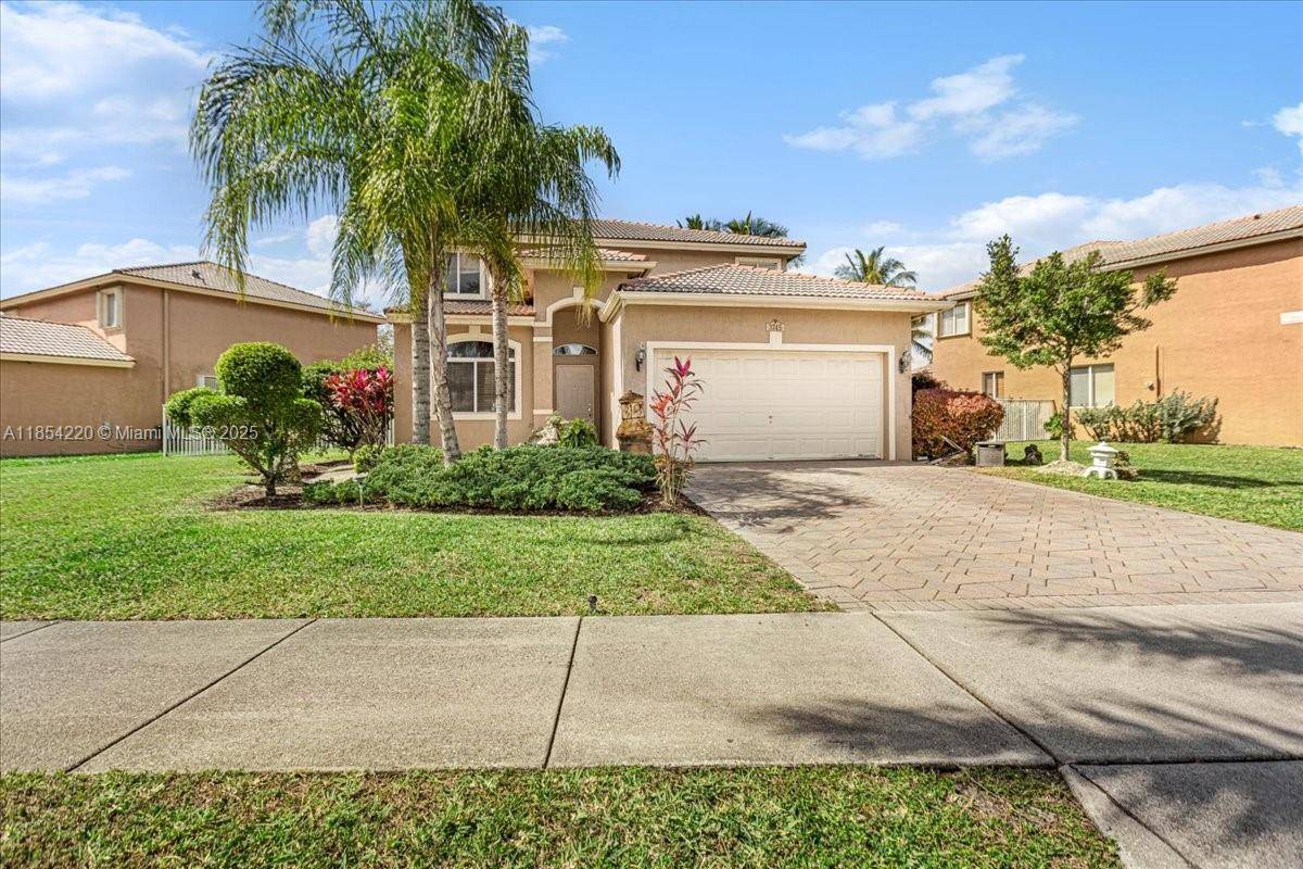 Beautiful two story home located in the desirable Banyan Creek community.