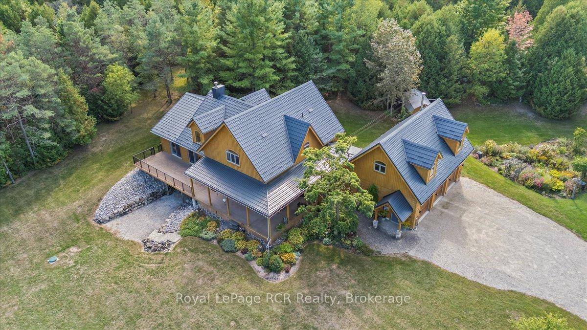 Luxury Country Retreat Nestled on a Peaceful, Private and Lovingly Landscaped 9.