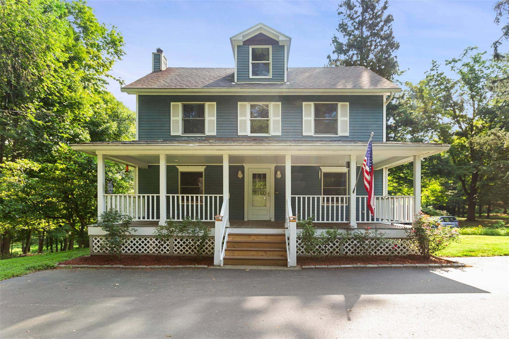 Welcome to this charming 1925 Colonial set on over 2 acres of scenic, park like grounds, located near both Lasdon Park and the Mildred B.