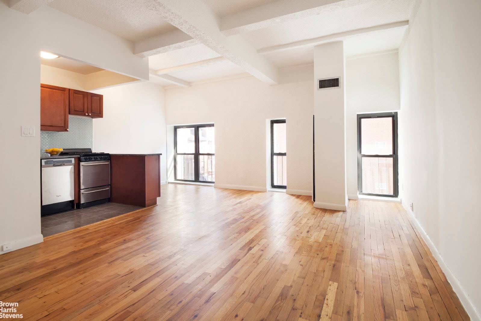 Renovated studio with open kitchen with a great dining area.