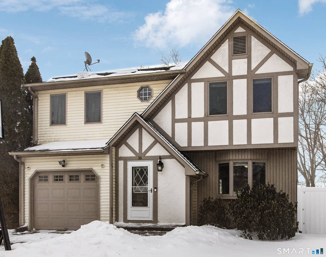 This storybook two story home beautifully blends classic character with warm, inviting curb appeal.
