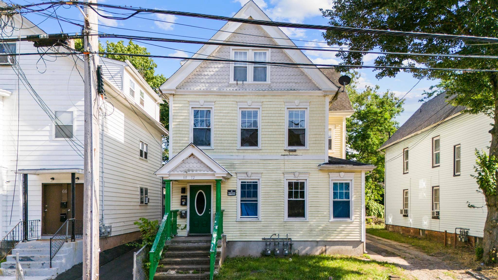 Welcome to this three family home located in the heart of the Newhallville neighborhood of New Haven.
