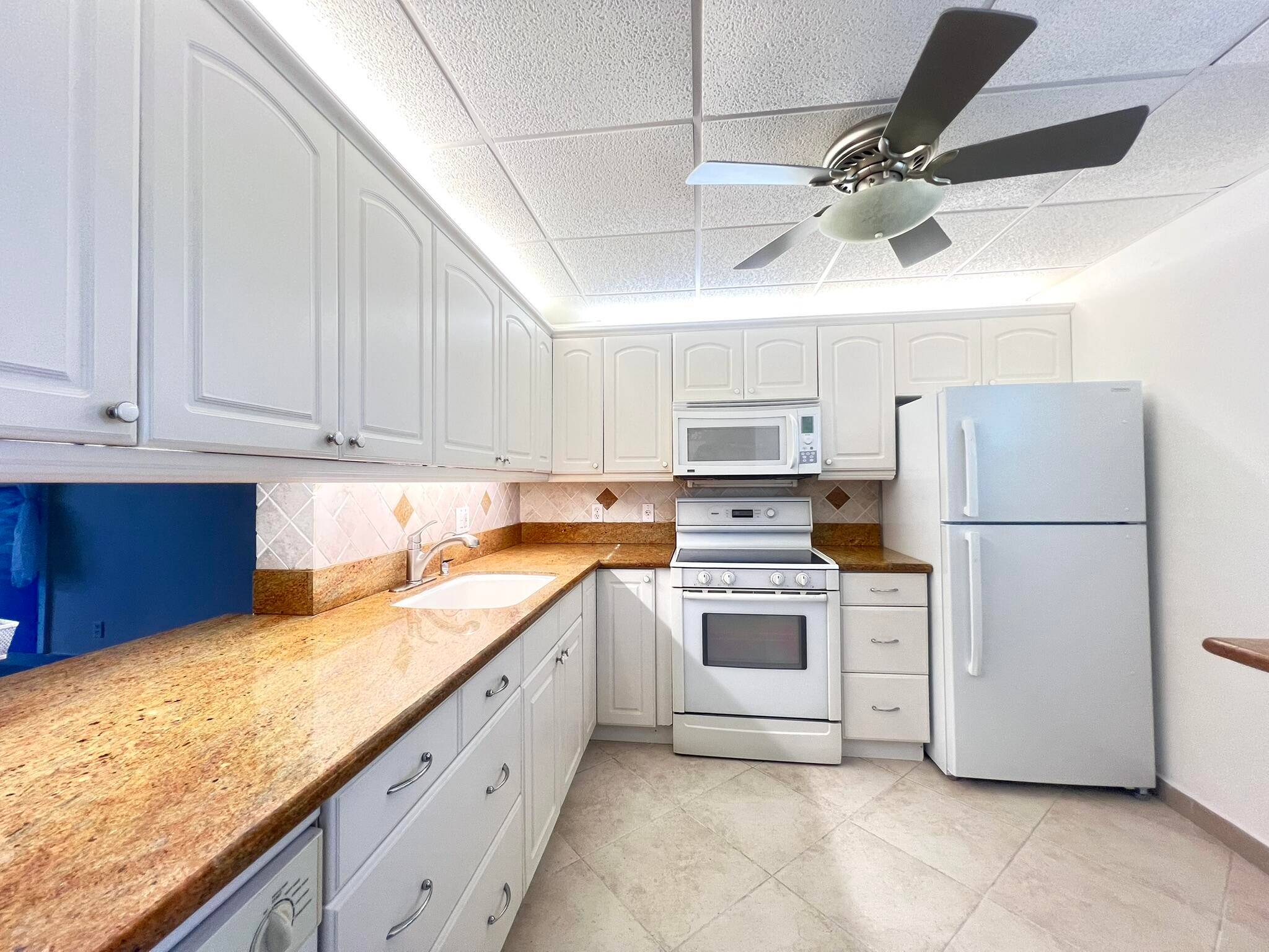 Discover the charm of this spacious 2 bedroom, 2 bathroom condo in the highly sought after Village Royale on the Green, ideally located in the vibrant community of Boynton Beach.