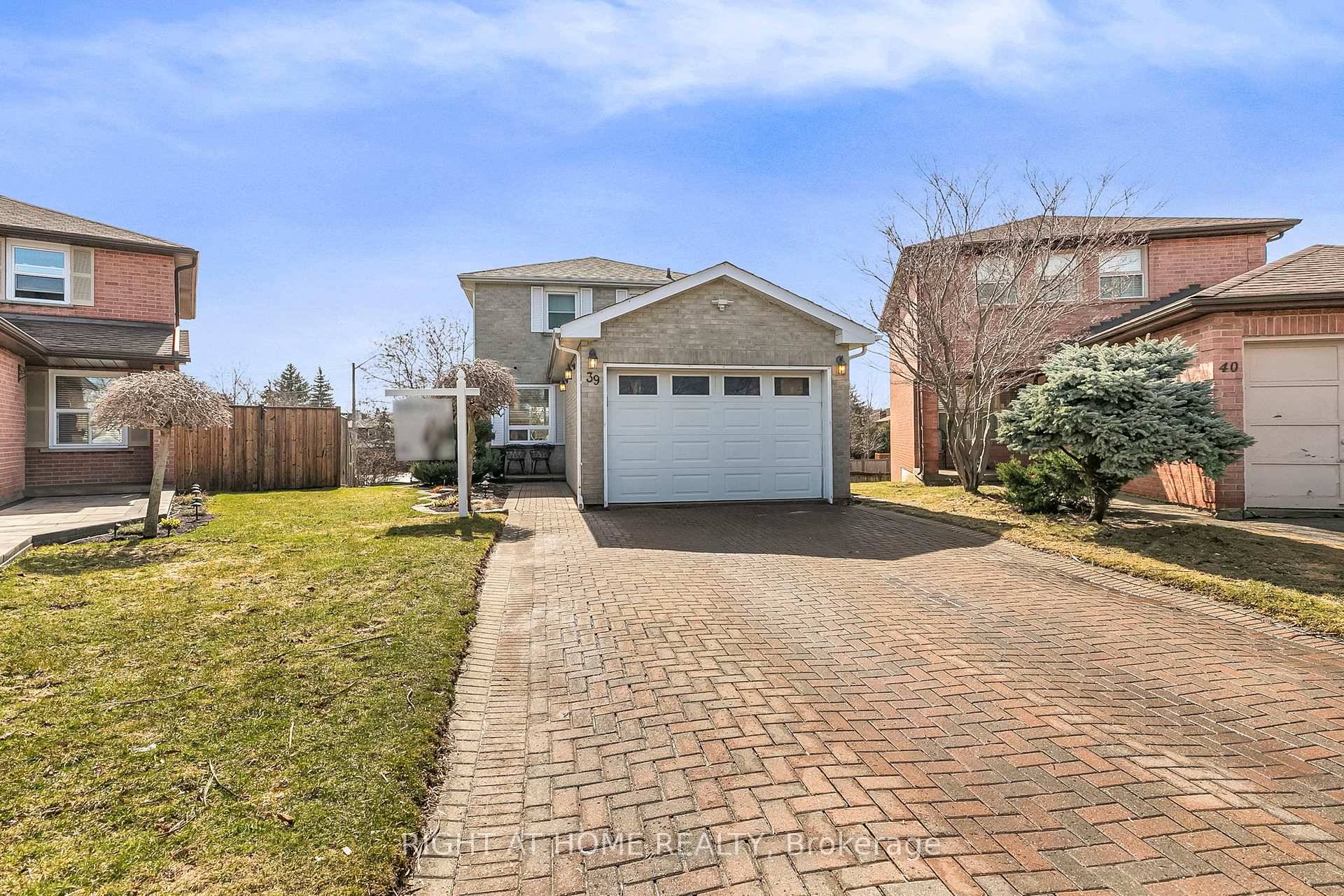 This beautiful fully detached, all brick home is nestled on a large pie shaped lot at the end of a private cul de sac !