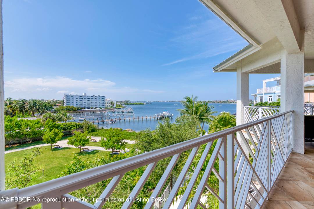 Experience the charm and spaciousness of this uniquely designed Key West style condominium, thoughtfully laid out to feel like a sprawling 2700 SF single family home.