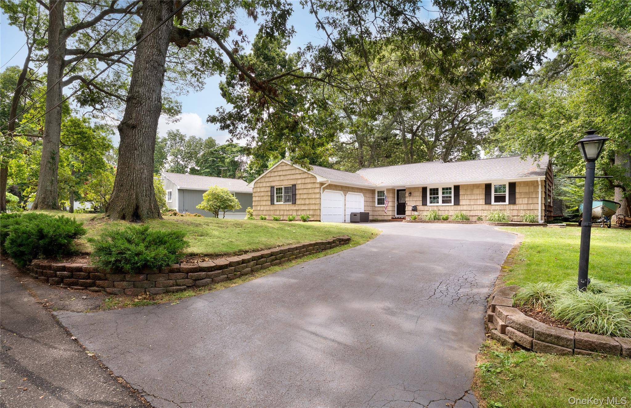 Welcome to the desirable Shoridge Hills community in Shoreham, where this expanded ranch combines comfort, style, and the best of North Shore living.