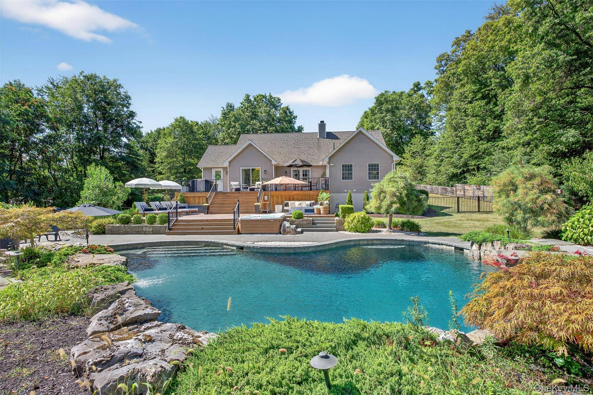 Welcome home to this exceptional 3 bedroom, 2 bath sprawling ranch set on 4 private acres in a truly idyllic setting.