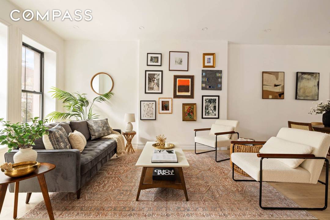 Welcome to this beautifully reimagined 1915 townhouse a fully gut renovated two family residence that seamlessly blends classic architecture with refined modern living.