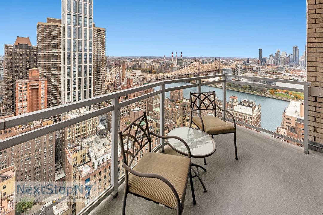 Perched on the 38th floor, this fully renovated oversized 2 bedroom, 2 bath beautifully designed apartment with sweeping North and East views of the city skyline and the East River.