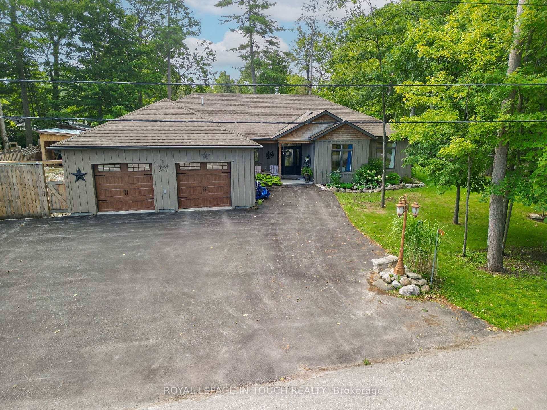 Welcome to 1 Spruce Street in Tiny Township a beautifully maintained, single level gem offered for the first time.