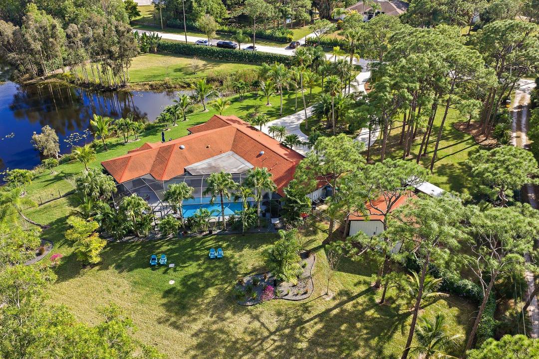 Set on a breathtaking 2. 5 acre fully fenced parcel in Jupiter Farms, this completely gutted and exquisitely renovated 5 bedroom, 3 bathroom residence offers rare privacy, serenity, and refined ...