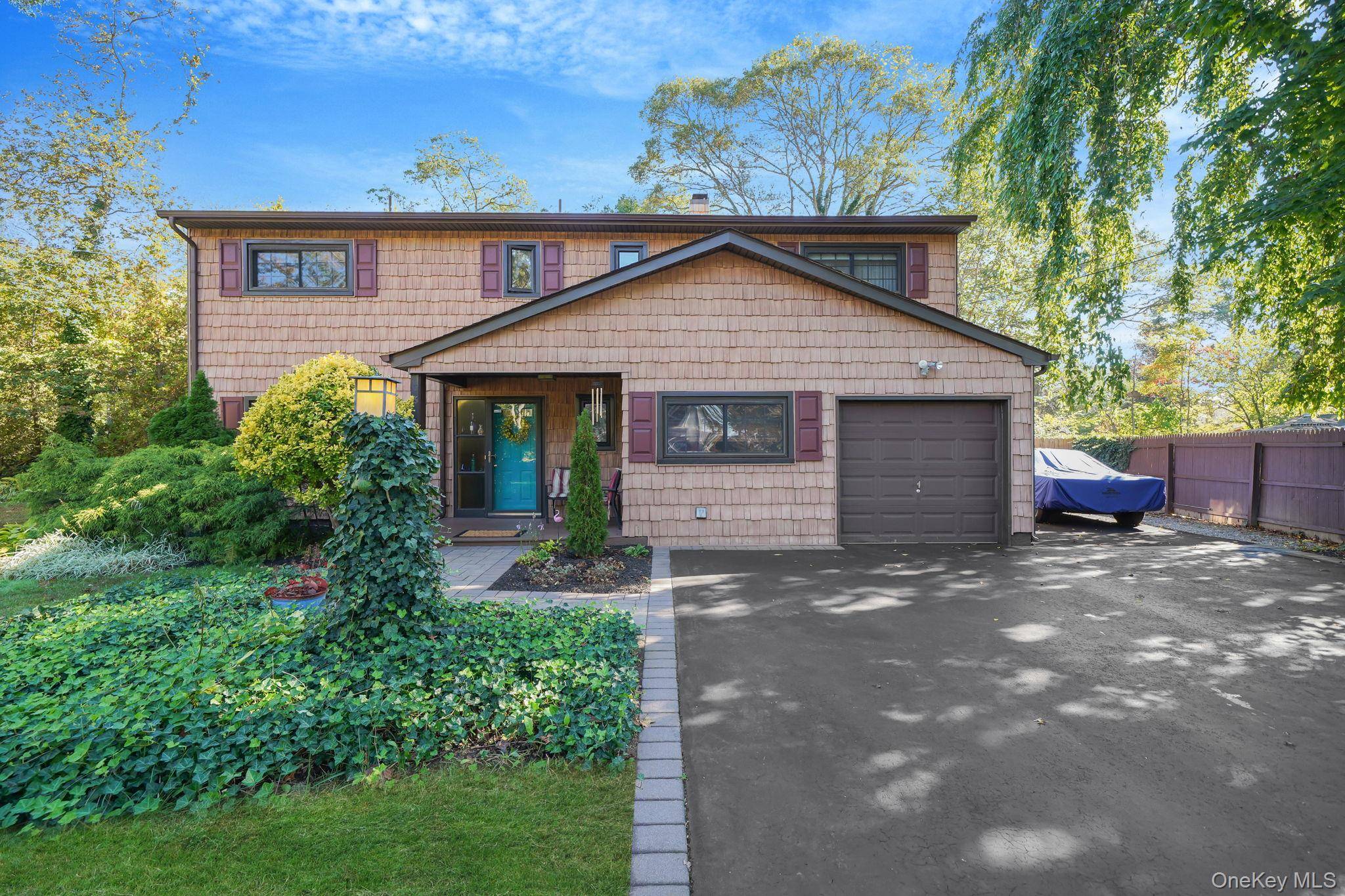 Spacious Splanch Style Home featuring a main level bedroom, formal dining room, kitchen with oven, stove, and refrigerator, den area, and half bathroom.