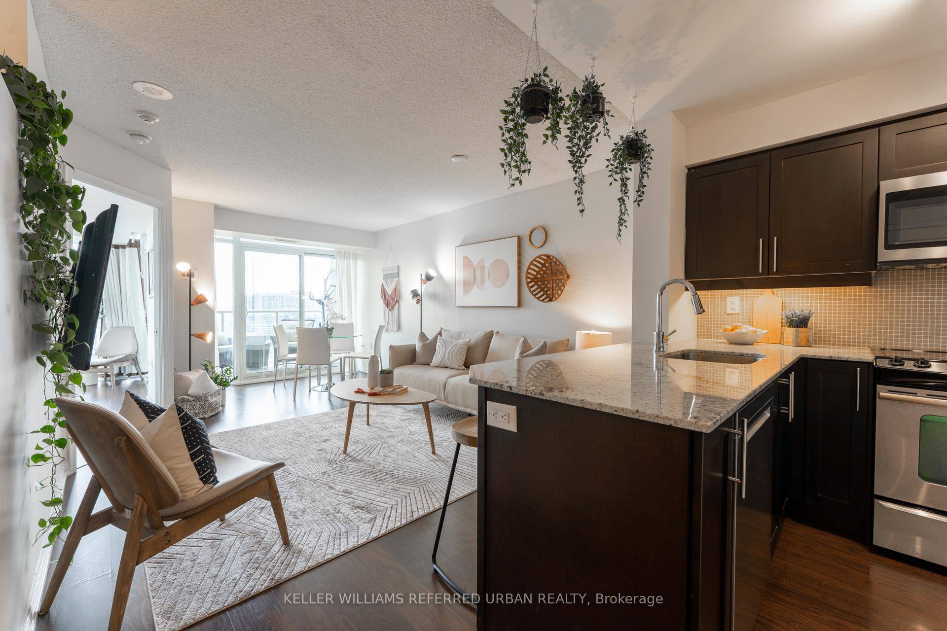 High floor, bright and spacious 1 den, 2 bath suite with parking and locker !