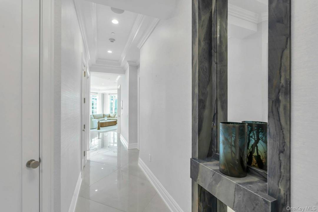 This exceptional penthouse residence offers three bedrooms and two and a half baths within a beautifully curated open layout.