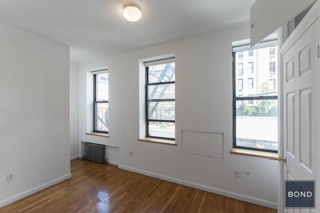 Large 2 bedroom railroad apartment in prime East Village location.