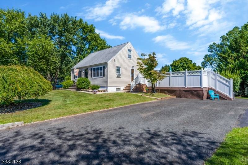 Welcome to this beautiful 3 bedroom Cape Cod situated on an oversized lot, offering both charm and functionality.