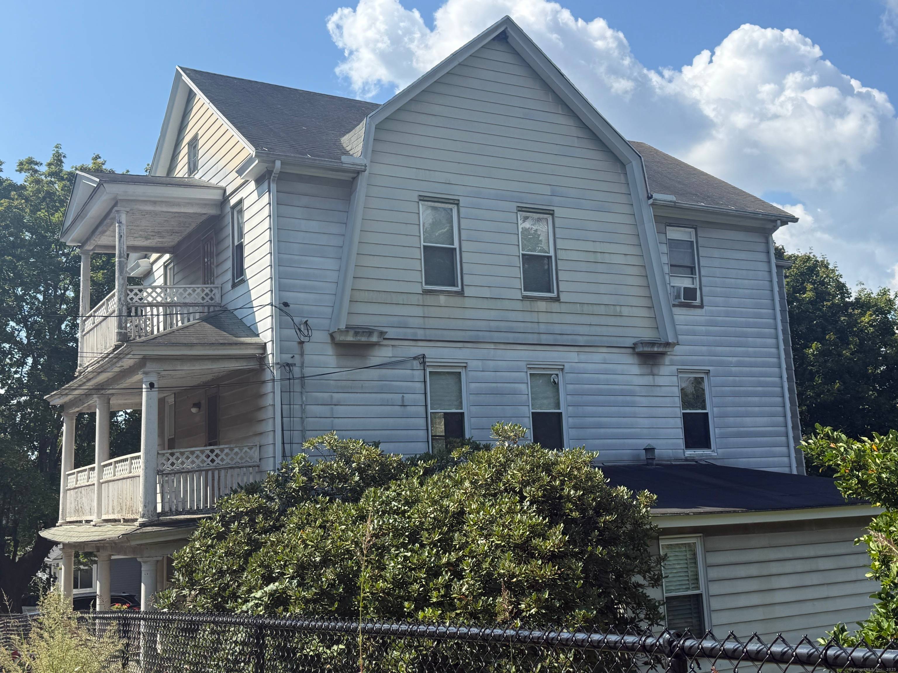 Investors take notice ! Spacious 3 family home, 5 car garage, 2 potential building lots !