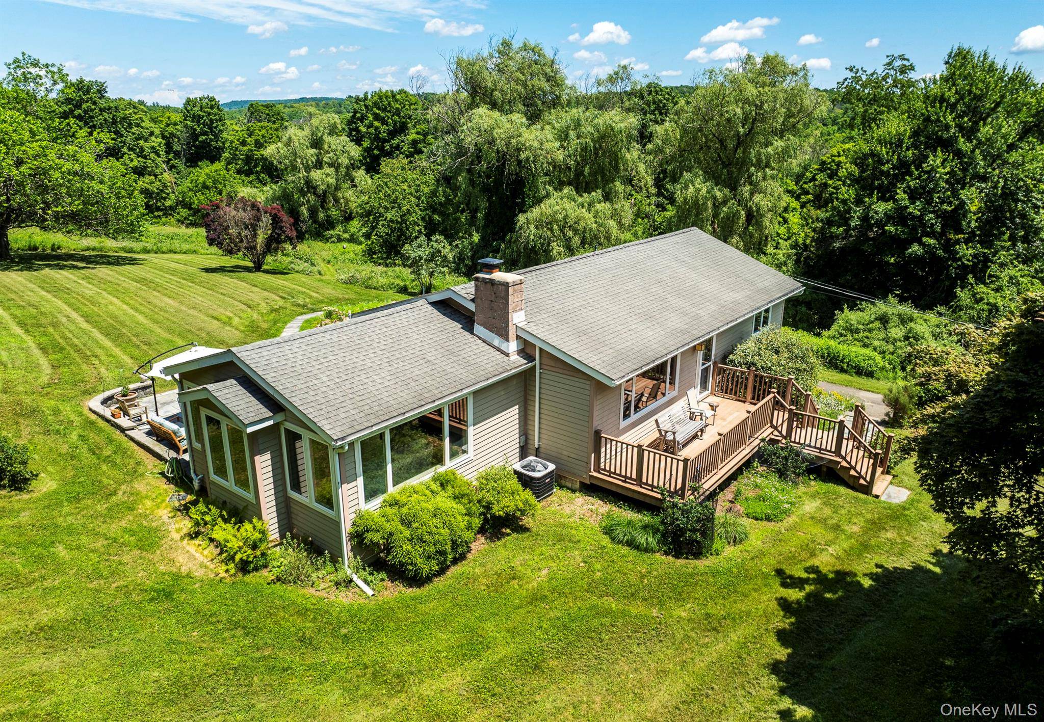 Set in the tranquil landscape in Clinton, this thoughtfully designed residence on 2.