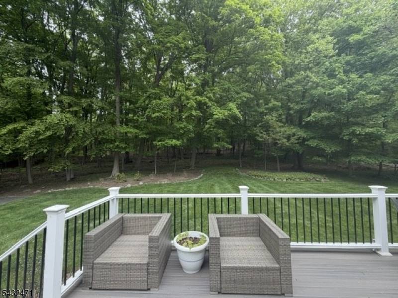 Welcome home to this beautifully maintained Colonial nestled on a manicured wooded lot in the highly sought after Pines Lake section of Wayne.