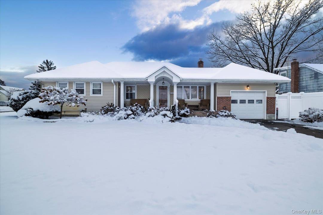 Home for the holidays ! Welcome to this generously expanded home in the highly desirable Forest City section of Wantagh.