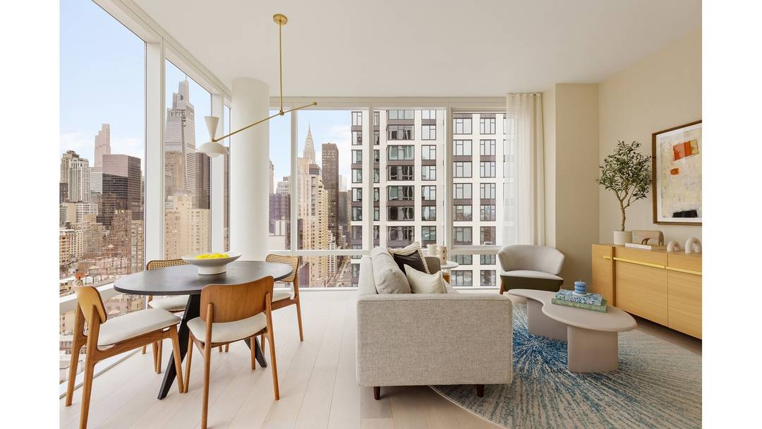 An Expansive Corner 2 Bedroom with a Sprawling Wrap Around Terrace Residences Feature Bosch in residence washer and dryer 7 white oak plank flooring Deluxe white marble kitchen countertops Premium ...