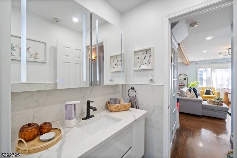 Welcome to this beautifully maintained, fully fenced in home featuring 3 bedrooms and 2 full bathrooms in the heart of Carlstadt.