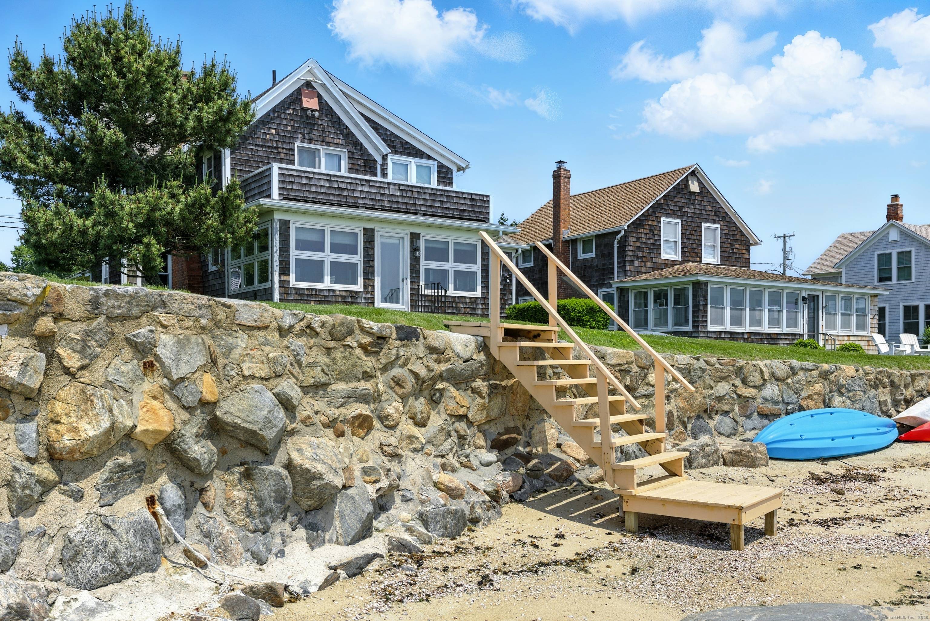 Spectacular Waterfront Home on Long Island Sound Step into a world of timeless elegance at this beautifully updated waterfront cottage, where classic New England charm meets modern comfort.