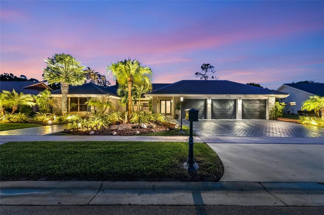 Discover 10182 Boca Woods Ln, a refined estate in Boca Raton s premier country club community.