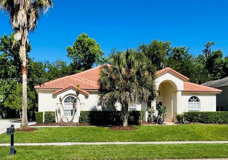 Beautifully updated pool home in a guard gated community nestled in a serene, park like setting with mature trees, wildlife, and wide streets perfect for biking, walking or jogging.