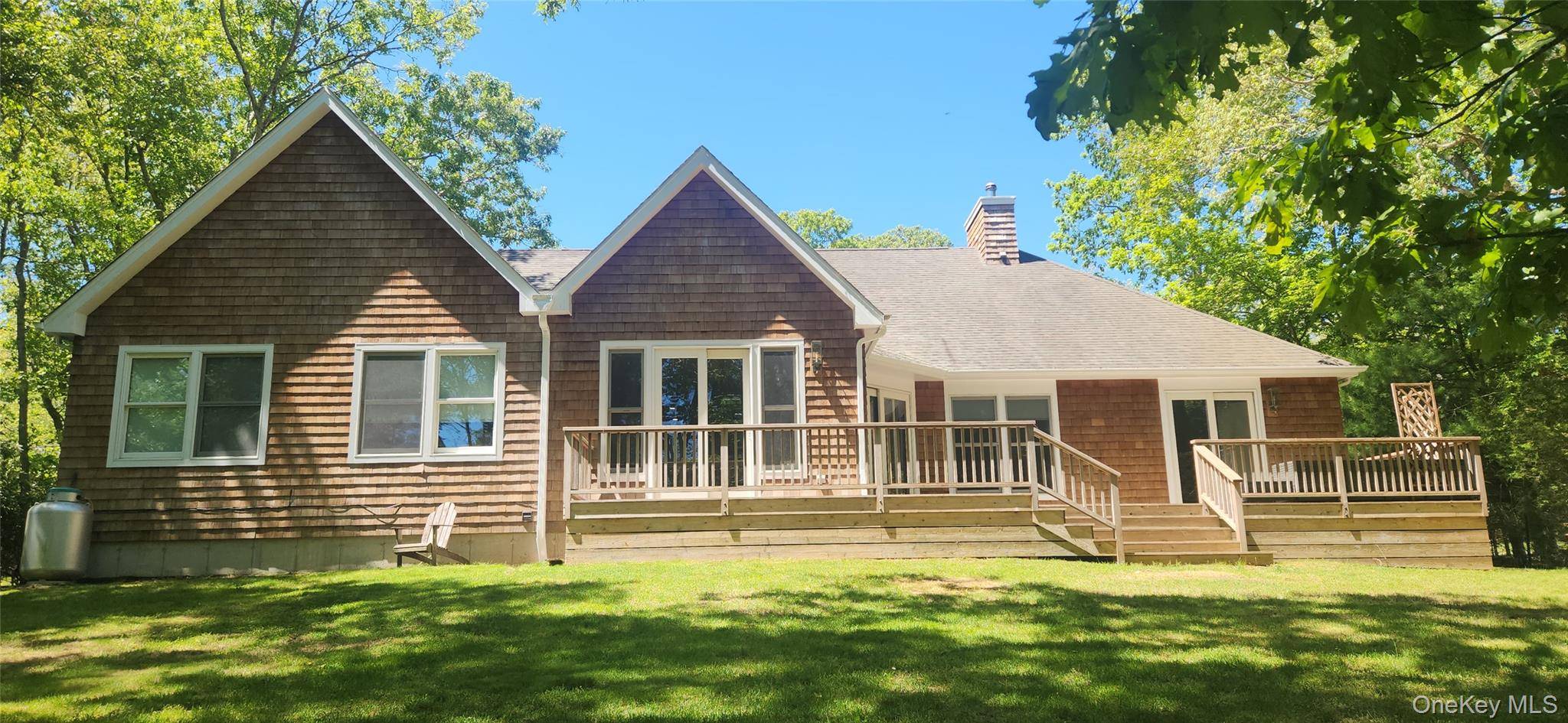 Come view this spectacular 2800 sq foot home with soaring ceilings and room for a pool in East Hampton.