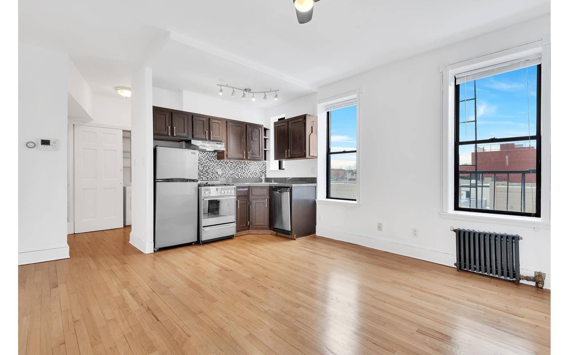This newly renovated, loft like sun flooded one bedroom apartment has beautiful hardwood floors throughout, abundant closet space, an in unit washer dryer and a video intercom.