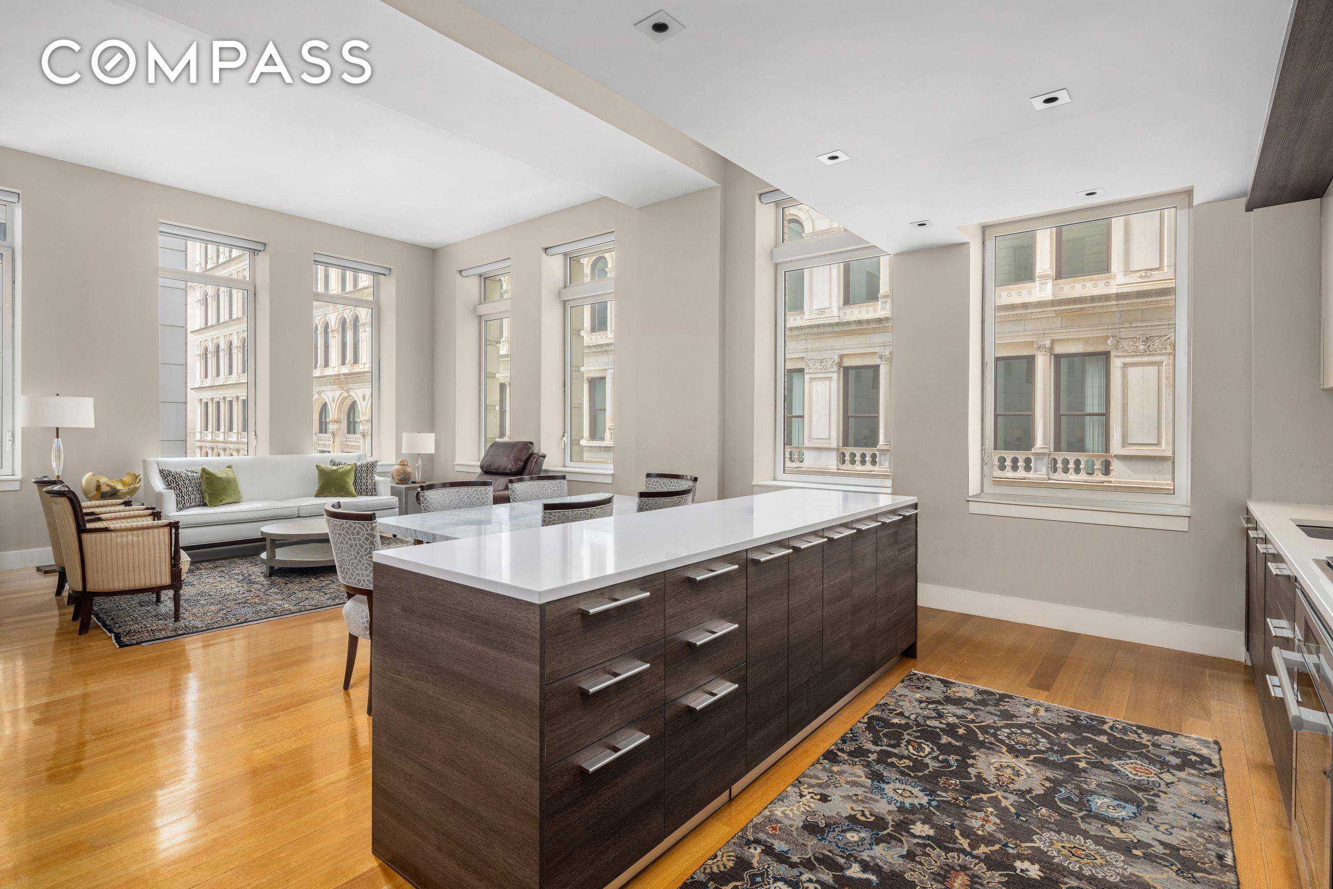 Residence 2E at The Leonard is a meticulously crafted three bedroom, three bathroom loft spanning nearly 2, 000 square feet, bathed in natural light from sweeping south and east exposures.