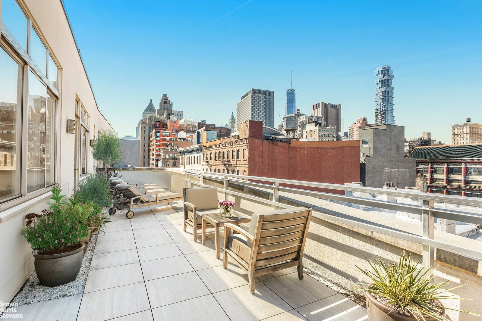 Sophisticated and stylish, this penthouse has an elegant and sprawling interior with soaring ceilings and long walls of windows.