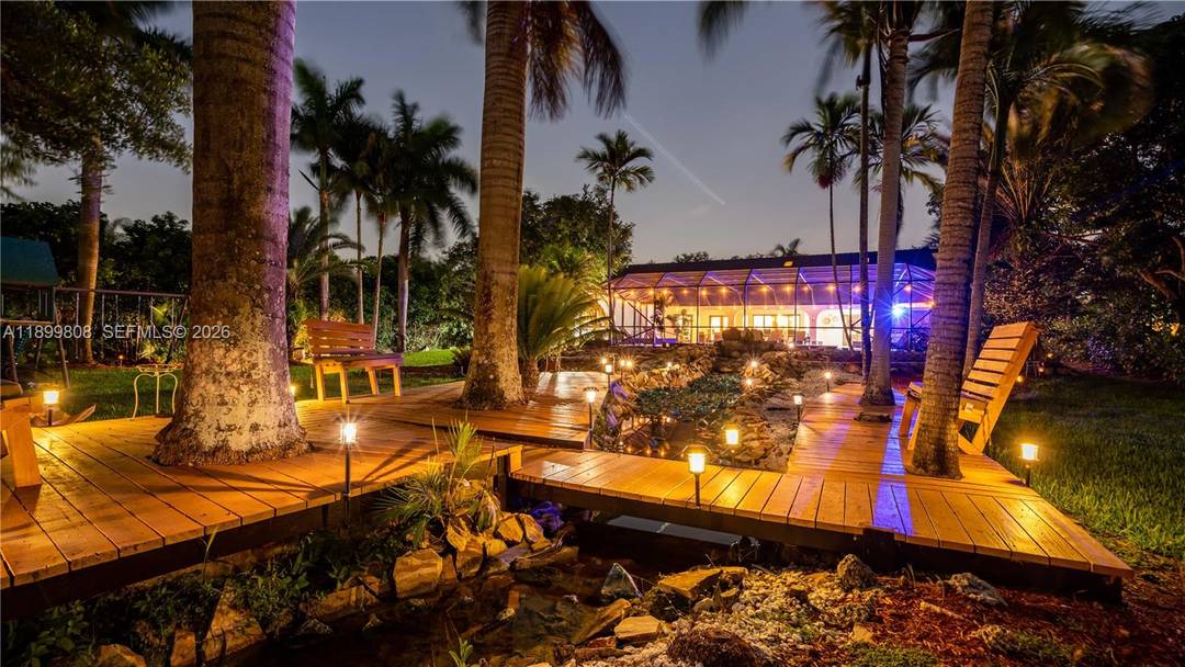 Experience luxury living in this stunning 7 bedroom, 5 bath estate located in the heart of Plantation.