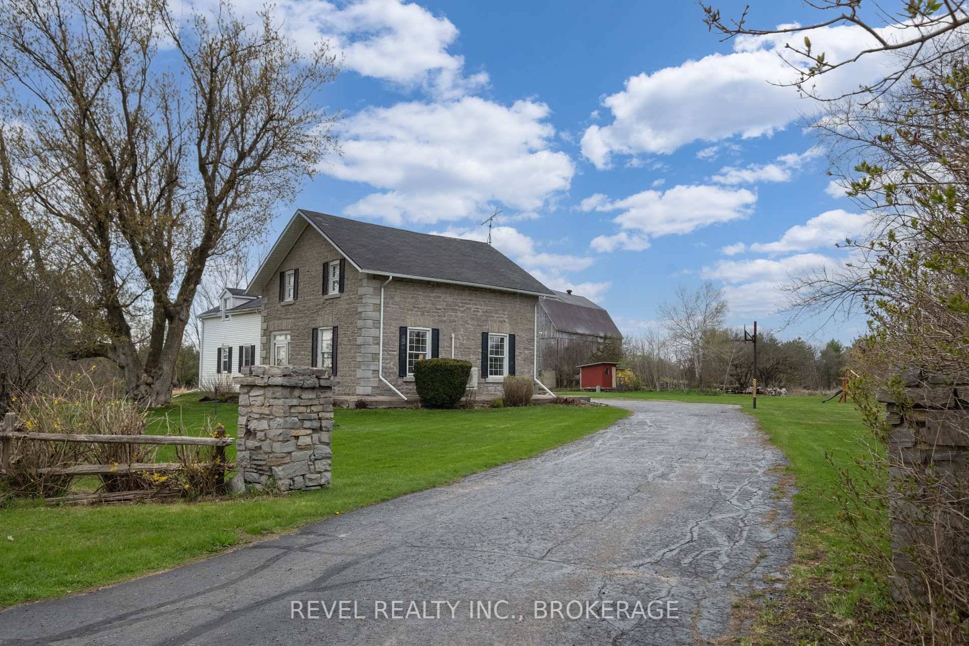 Welcome to 2964 Highway 38, a breathtaking limestone century home set on 30 picturesque acres, just 7 minutes from Kingston.