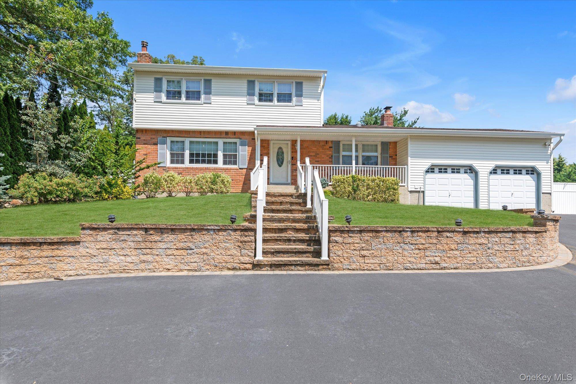 Beautifully situated in The Pines of Smithtown, this charming 3 bedroom, 2 bath Colonial welcomes you with a classic front porch and timeless curb appeal.