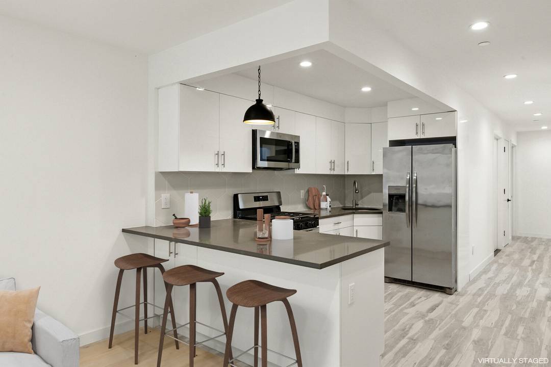 Stylish Duplex Living in Greenwood Heights Your Urban Fall Sanctuary Welcome home to this brand new modern duplex condo that marries sleek design with versatile spaces perfect for cozying in ...