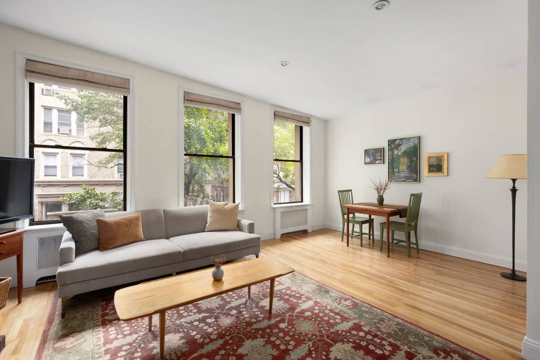 Charming pre war 1 bedroom convertible 2 bedroom on tree lined upper west side block Enter this spacious, light filledn home with triple, oversized north facing windows looking onto the ...