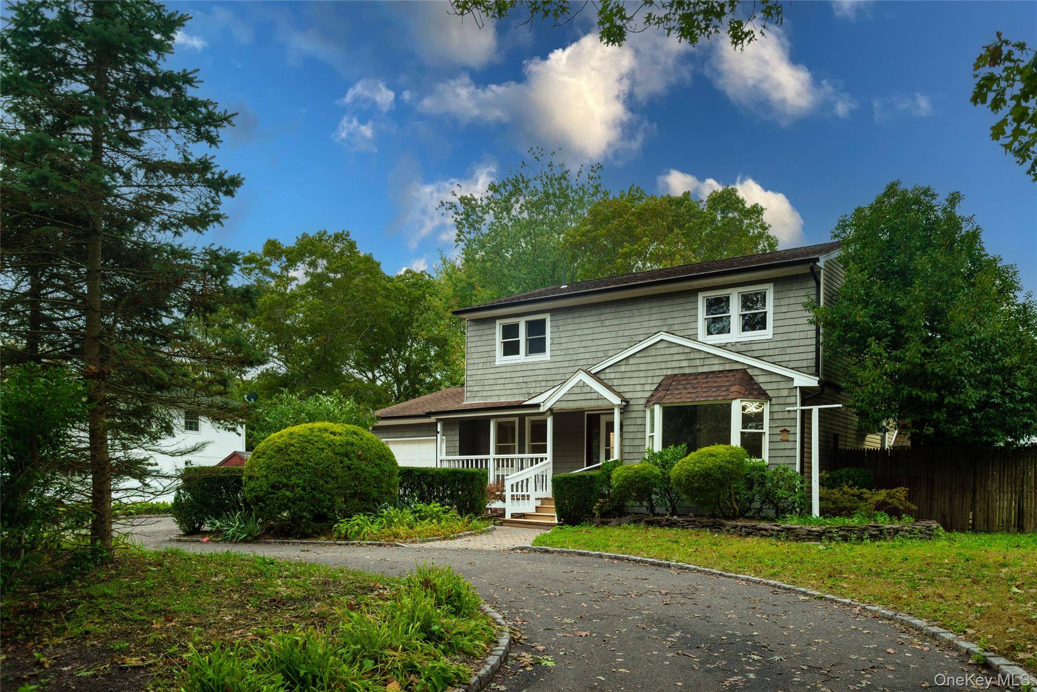 Step into timeless charm with modern flair in this beautifully renovated Colonial nestled in the heart of Shirley.