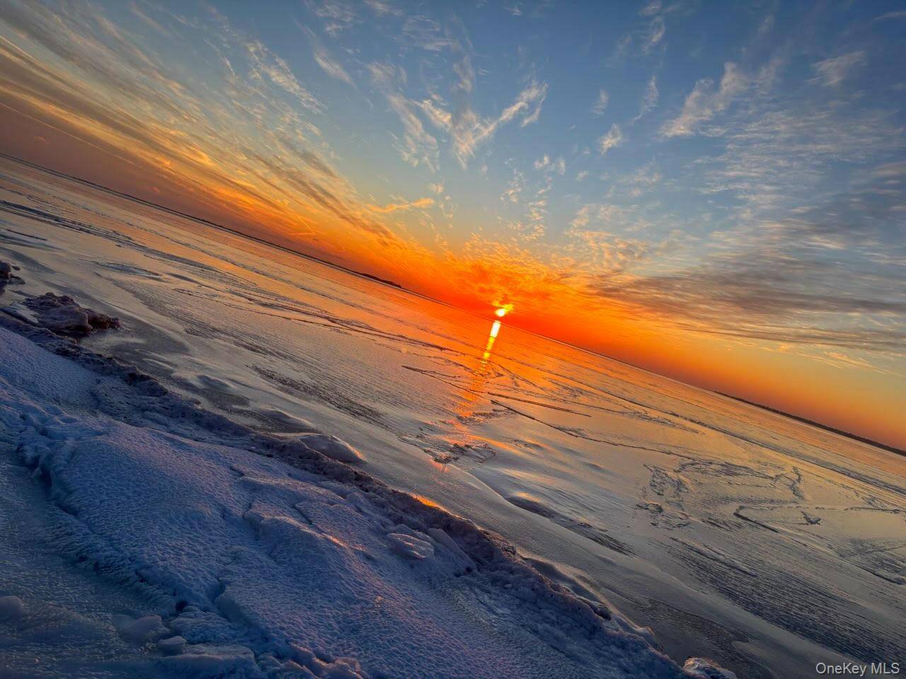 Welcome to this rare waterfront property with private beach rights, perfectly situated near Smith Point Beach in Shirley.