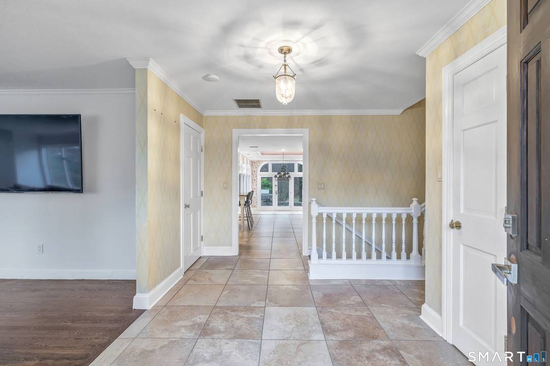 Welcome this private country retreat, nestled on a picturesque 2 acre lot on a quiet cul de sac in western Newtown.