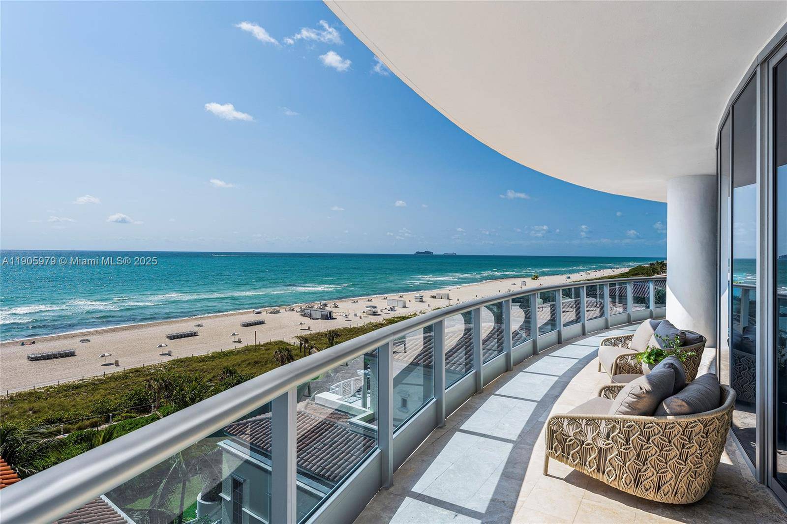 This contemporary oceanfront residence at the exclusive Bath Club defines modern coastal sophistication.