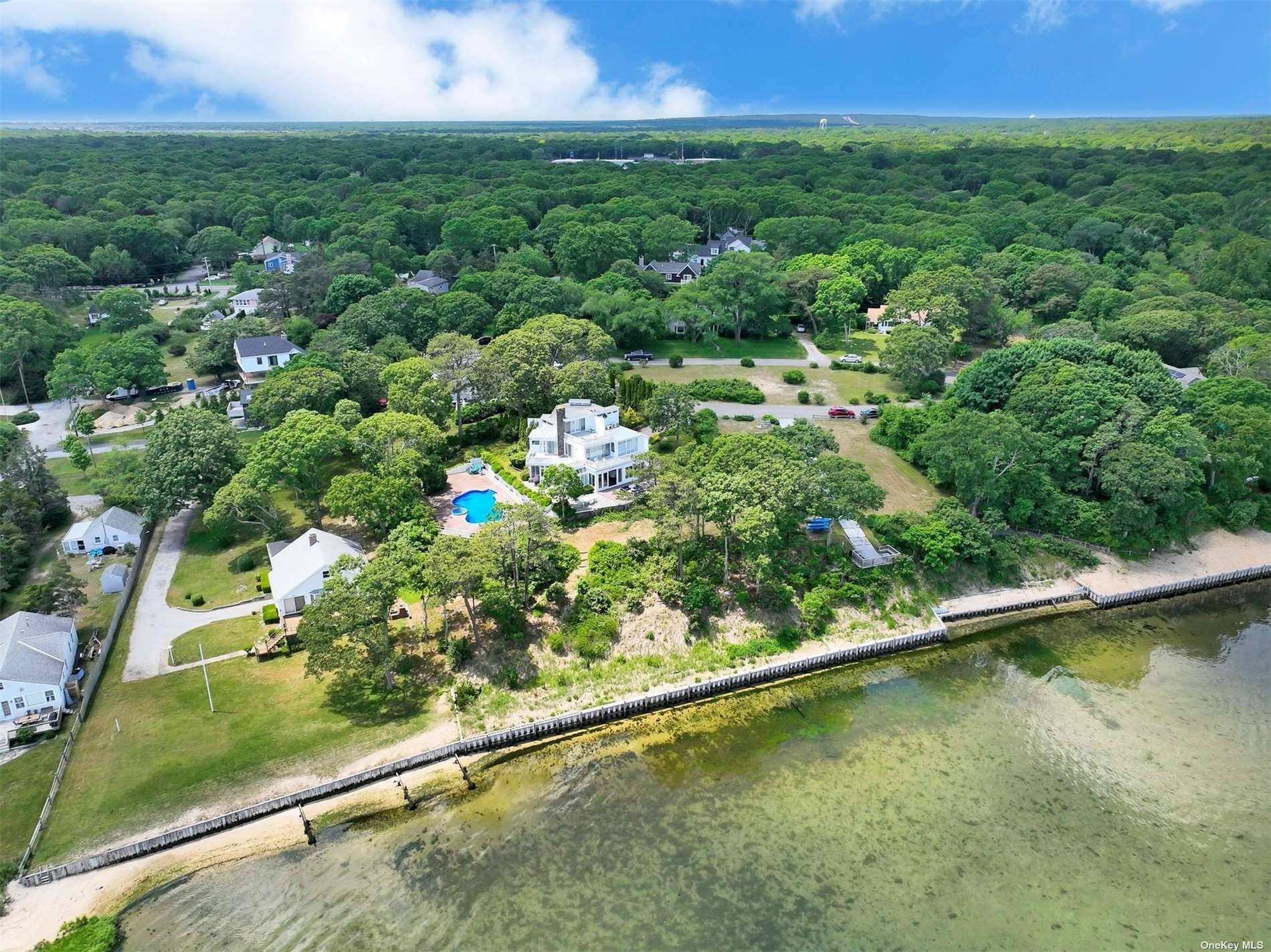 Modern home nestled on Shinnecock Bay is a dream with water views from every room.
